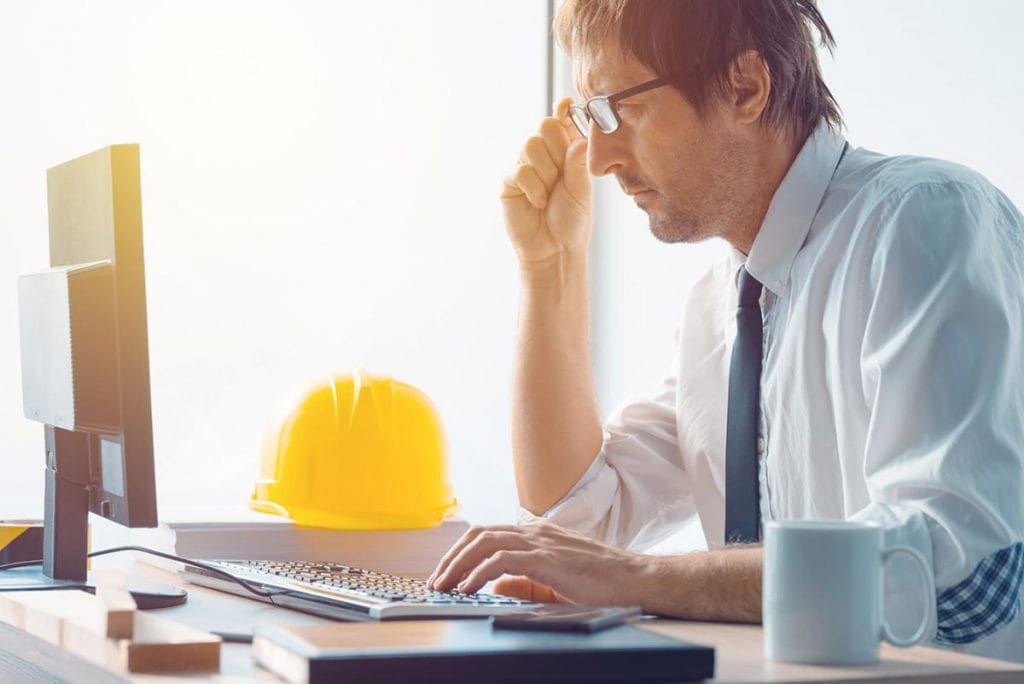Construction engineer working with desktop
