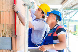 Construction workers on site checking quality