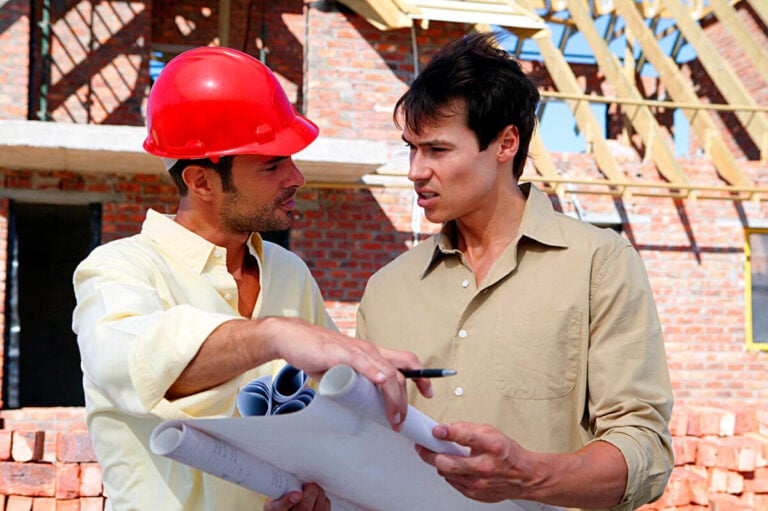 Contractor and client at construction site