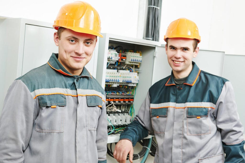 happy electrician engineer workers