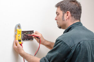 Technician working on a thermostat