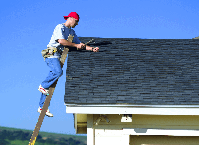 Roofer on top of the roof